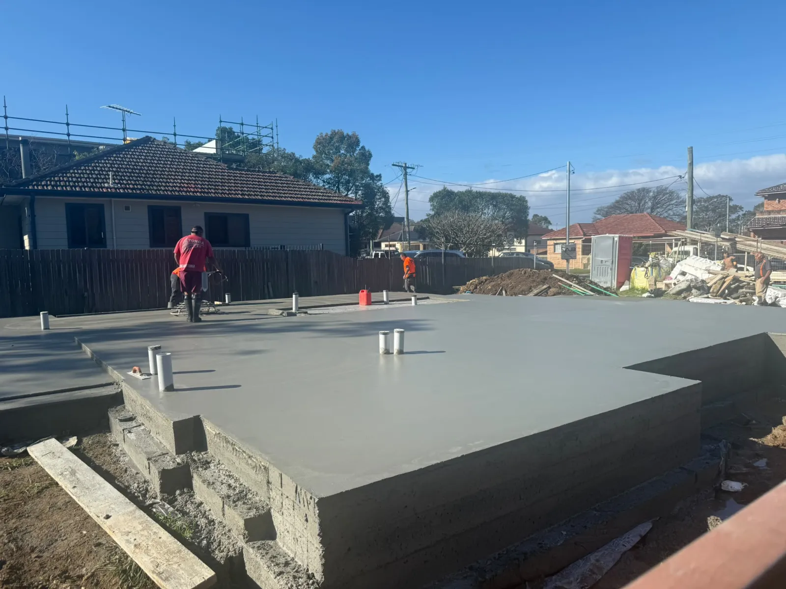 Freshly poured and floated concrete slab on the Brennan Construction duplex site